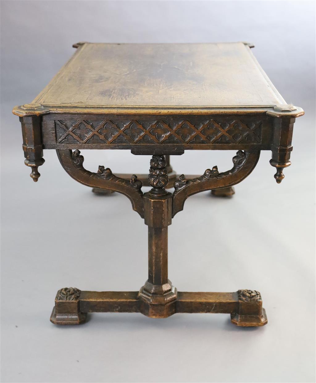 Attributed A.W.N. Pugin, A Victorian oak Gothic revival writing table, W.4ft 5.5in D.2ft 9.5in. H.2ft 6in.